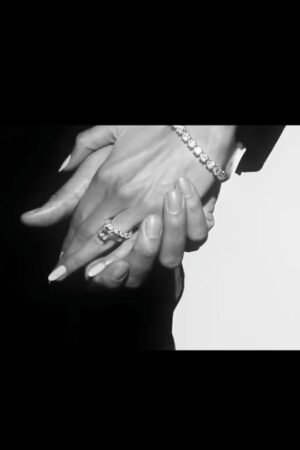 Timeless Black-and-White Hand Embrace with Jewelry